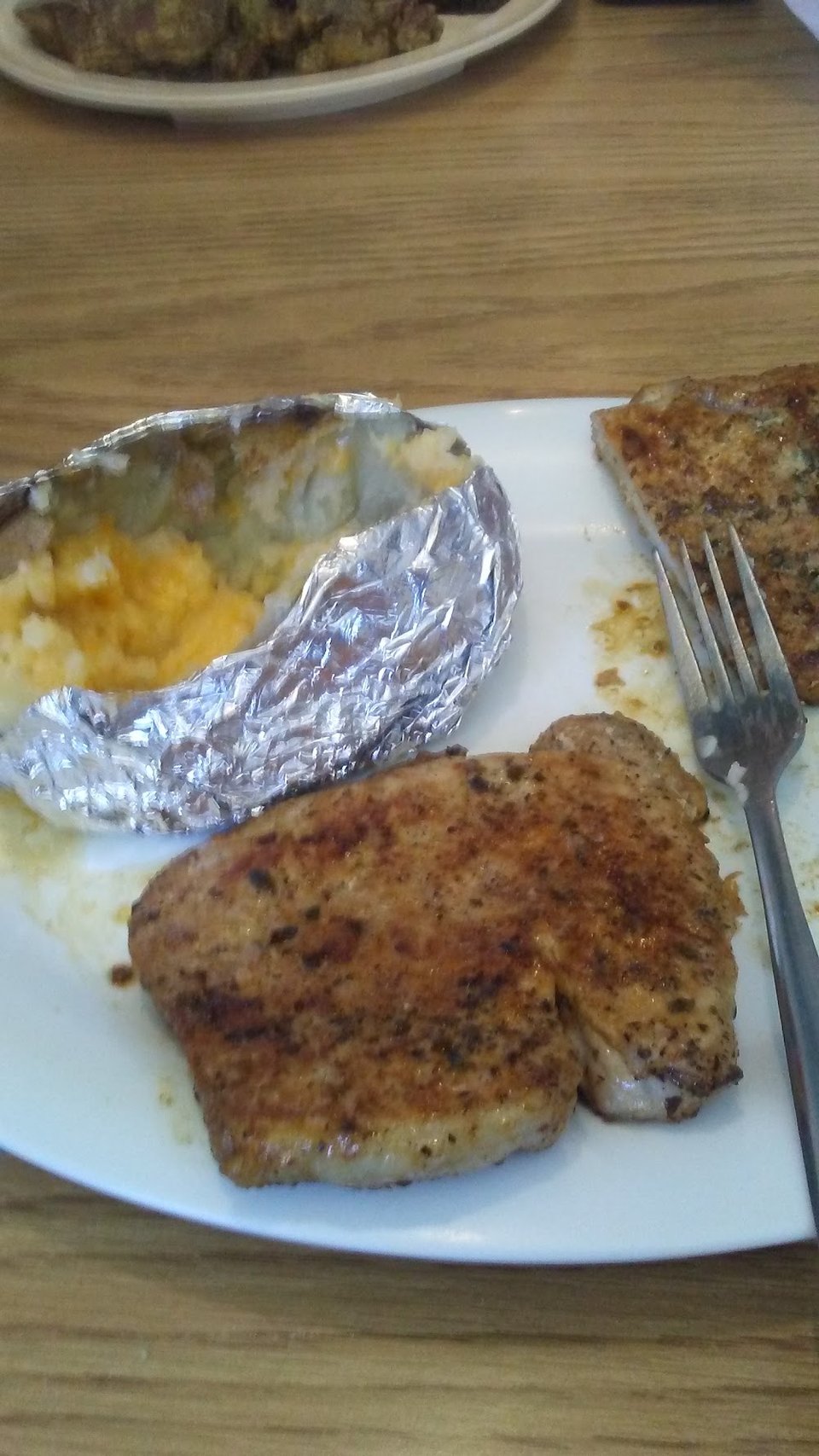 Baked Potato and Pork Chops